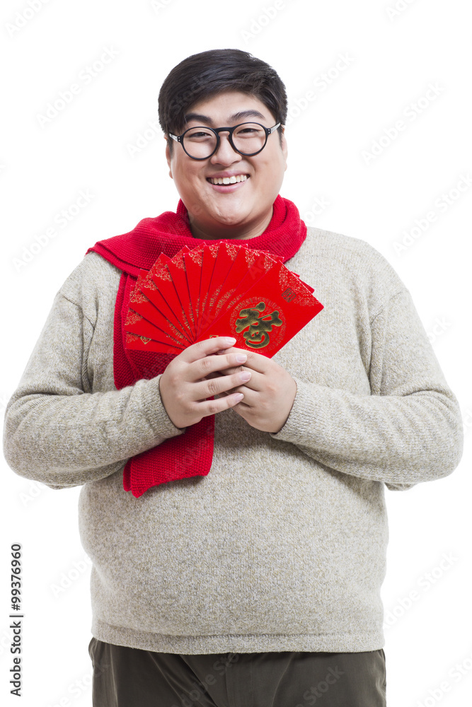 Chubby young man with red packets celebrating Chinese New Year