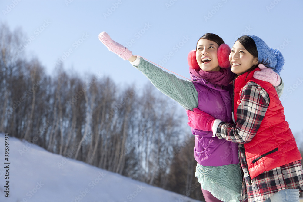 Happy young women in ski resort