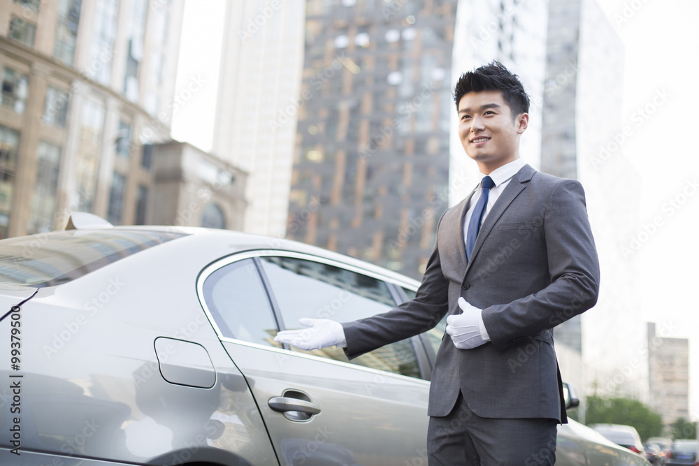 Chauffeur greeting next to the car