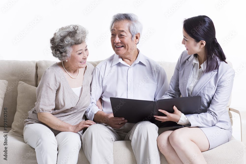 Senior couple chatting with financial advisor