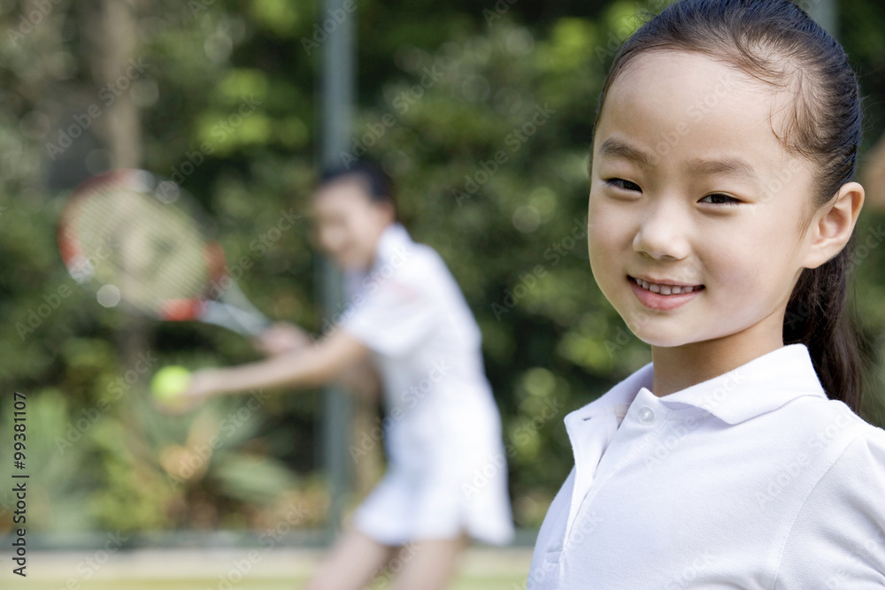 Mother and daughter on the tennis court