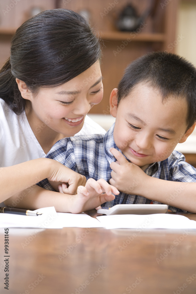 Mother and son doing calculation