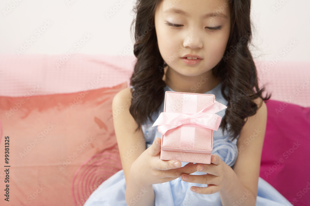 Girl Looking At Gift Box