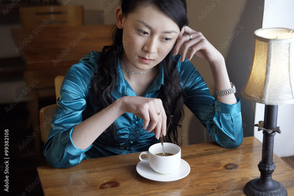 Woman Drinking Coffee Looking Contemplative