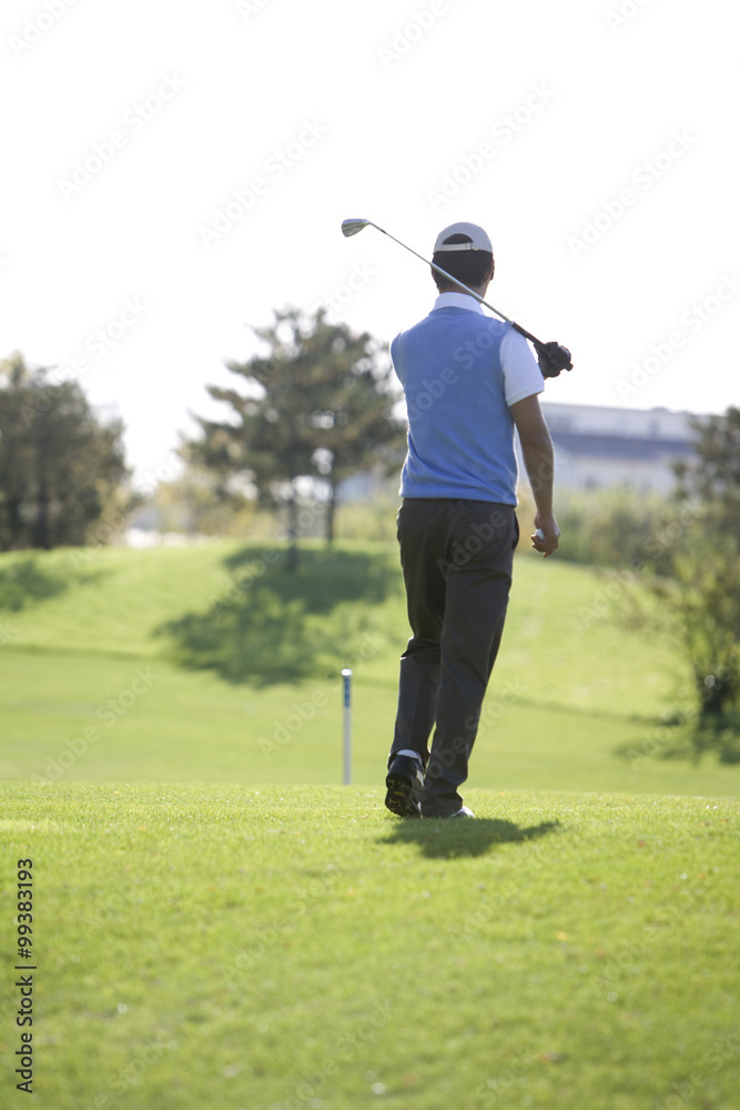 Man holding golf club