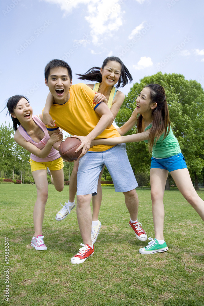 Group of friends playing American Football