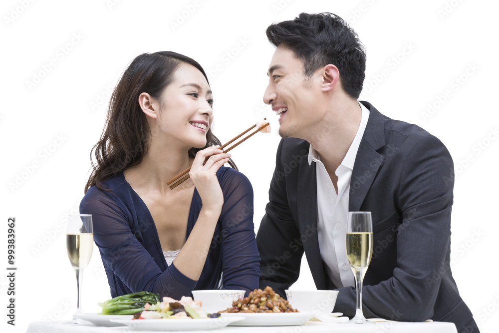 Happy young couple having dinner