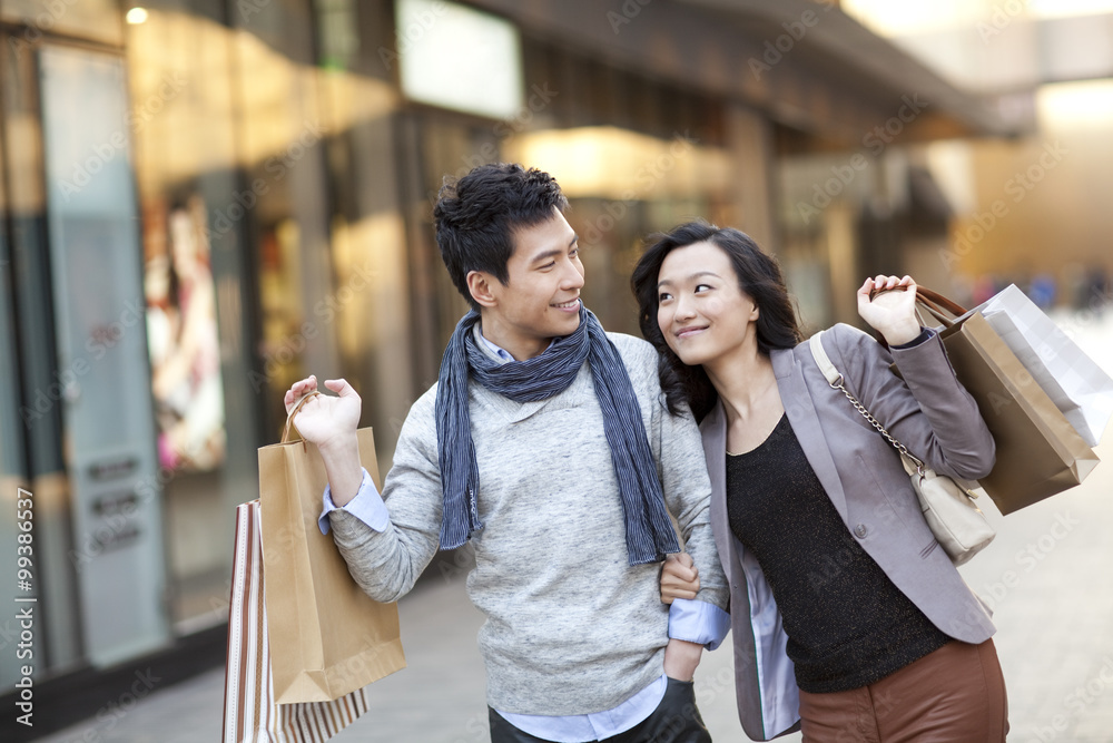 Fashionable young couple shopping