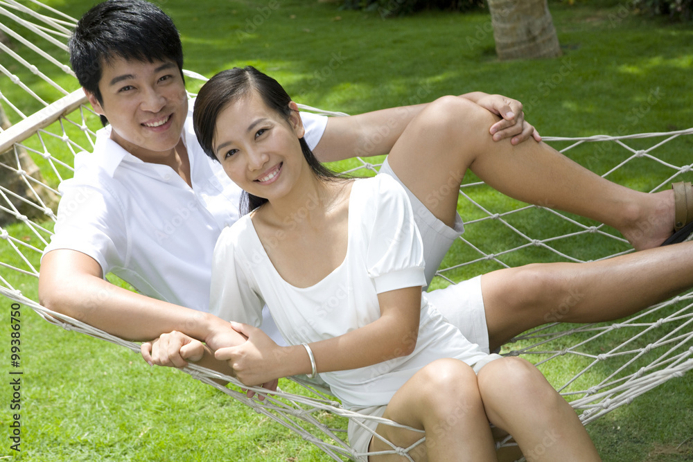 Portrait of a young couple in a hammock