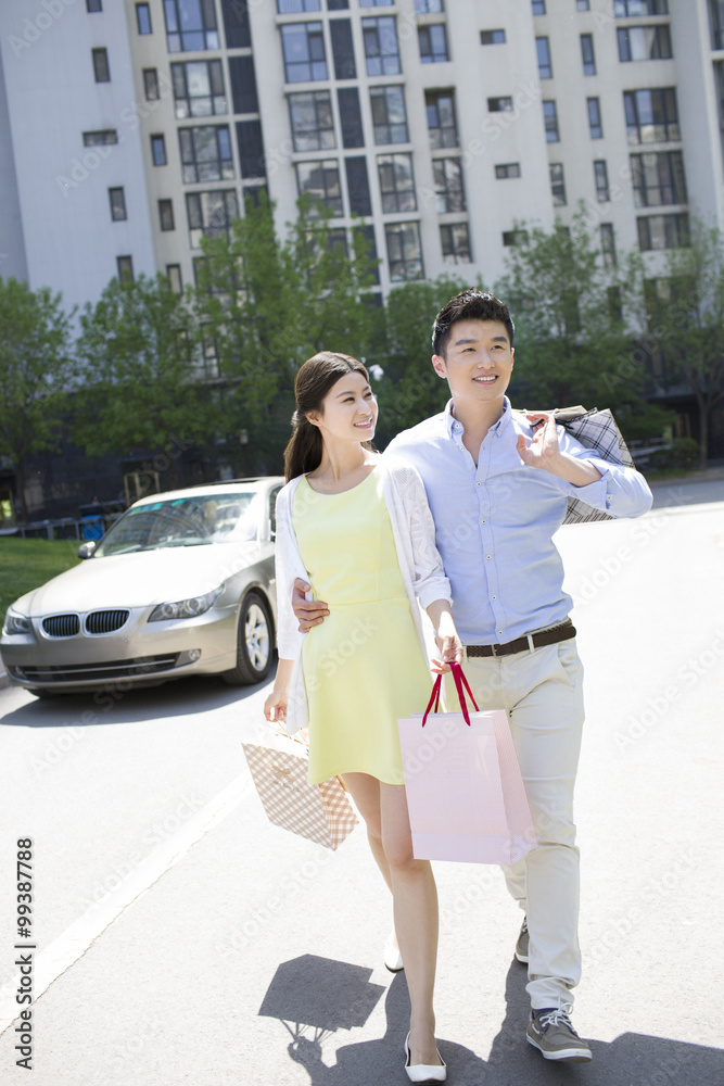 Happy young couple shopping