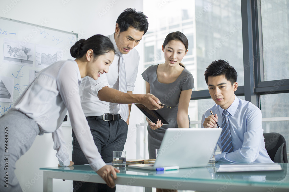 Young business people talking in meeting