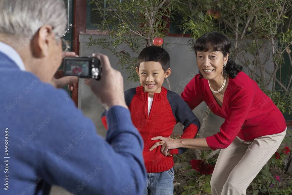 Family Taking Photographs Of Each Other