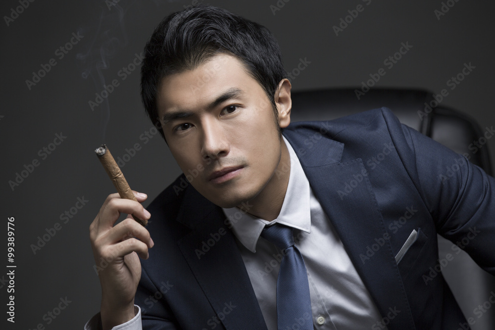 Confident businessman with cigar