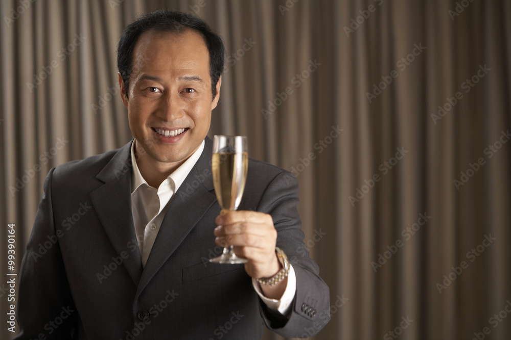 Man holding a glass of champagne