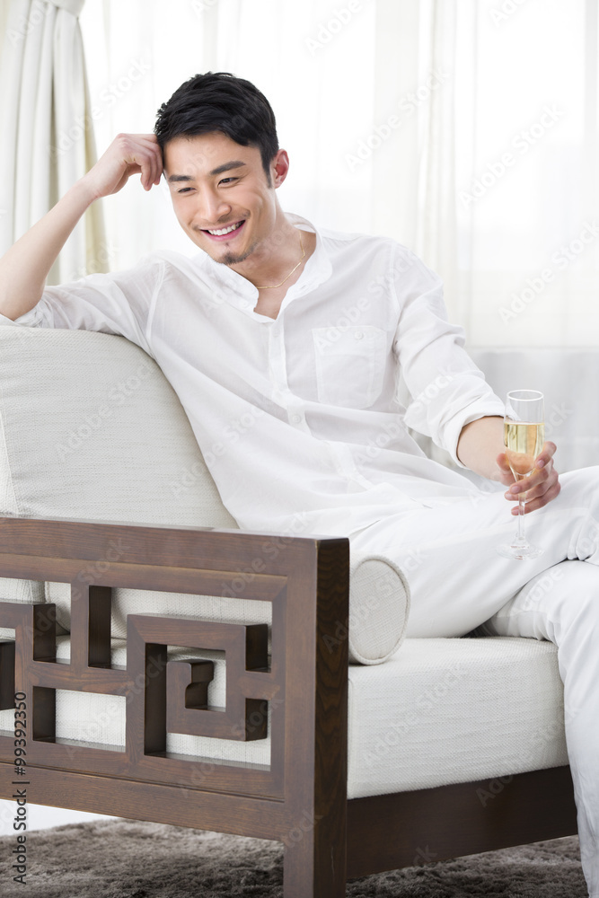 Happy young man with champagne