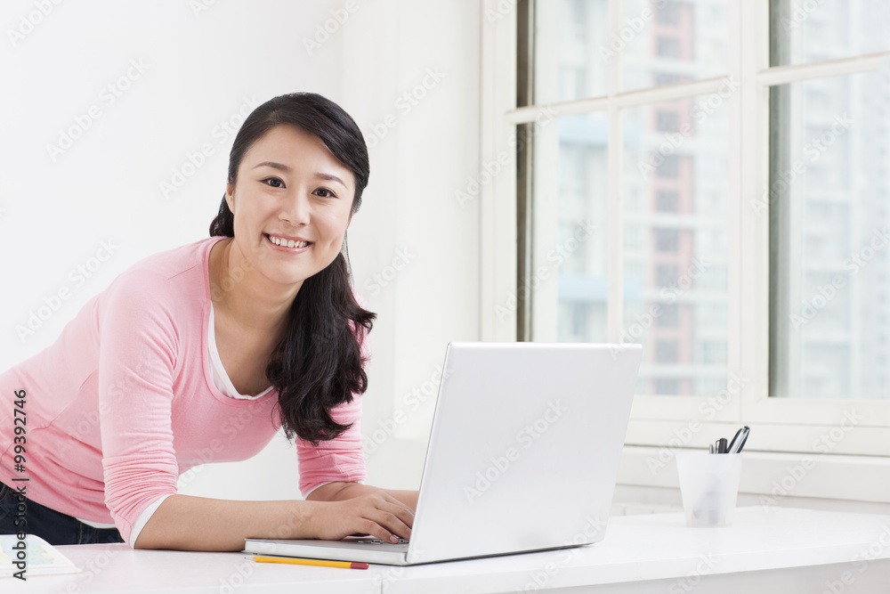 Young college student surfing the net in classroom