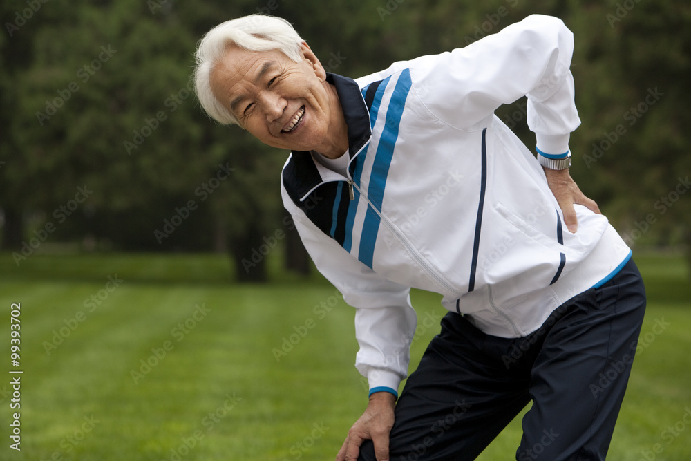 Senior Man Stretching in a Park