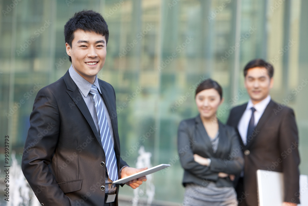 Business people outside office building