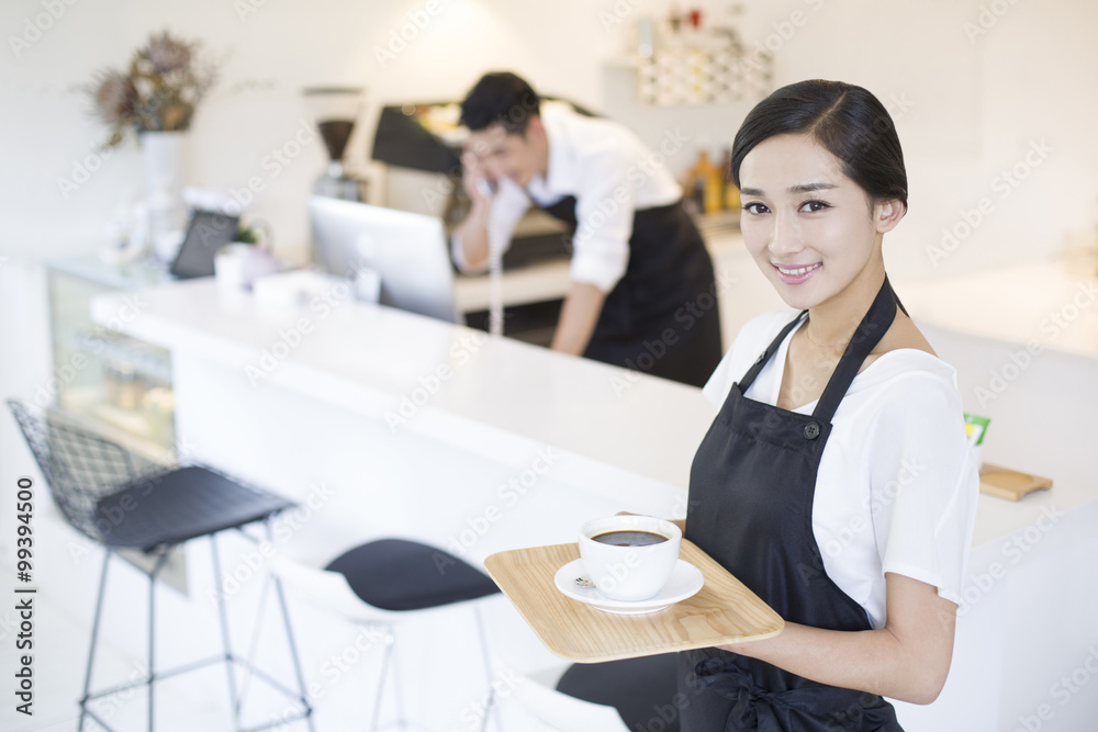 Portrait of coffee shop waitress