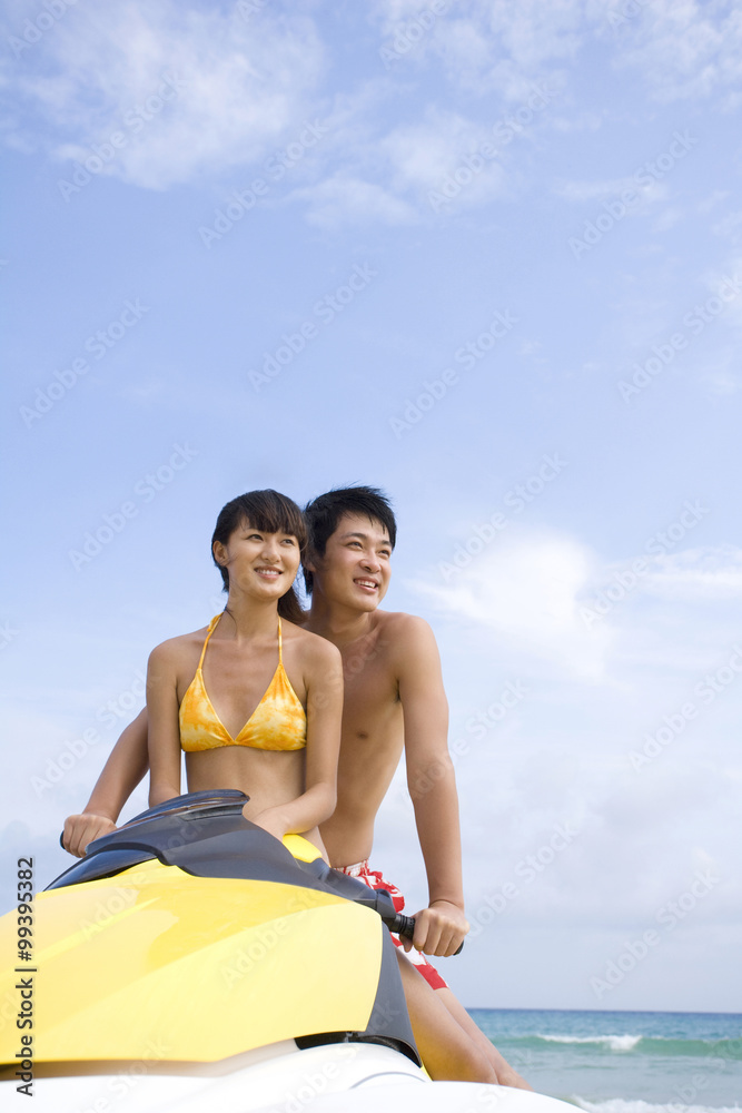 Young couple on a jet ski