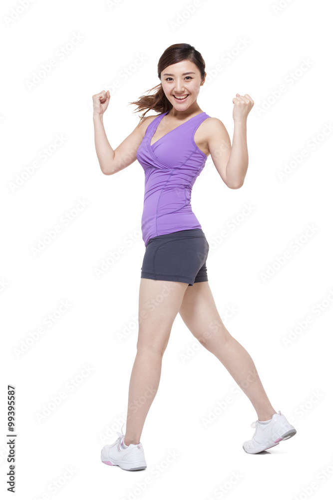 Young woman practicing aerobics