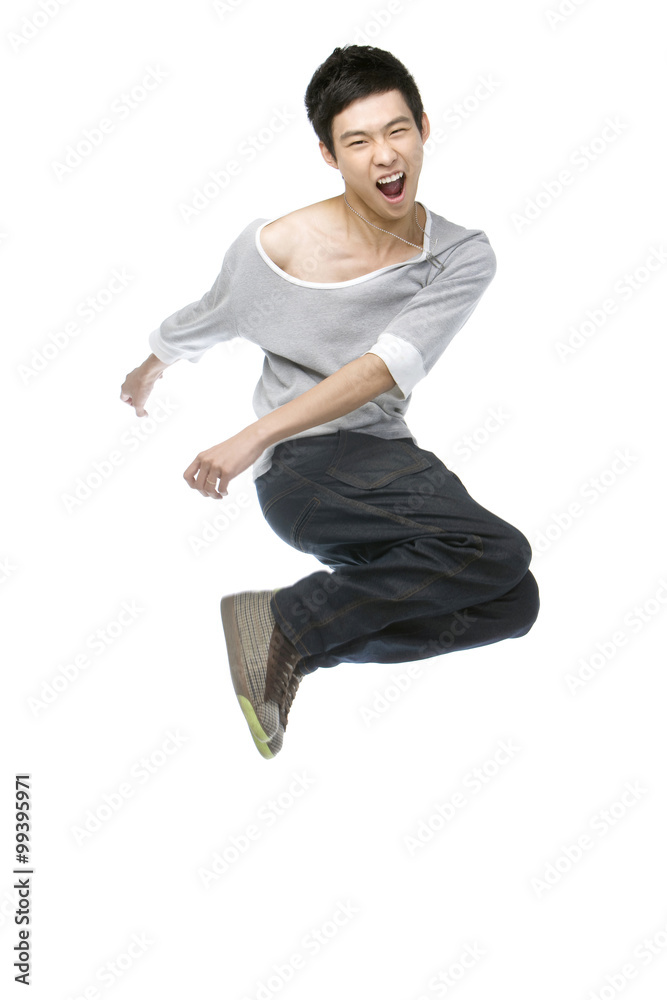 Young man jumping in mid-air