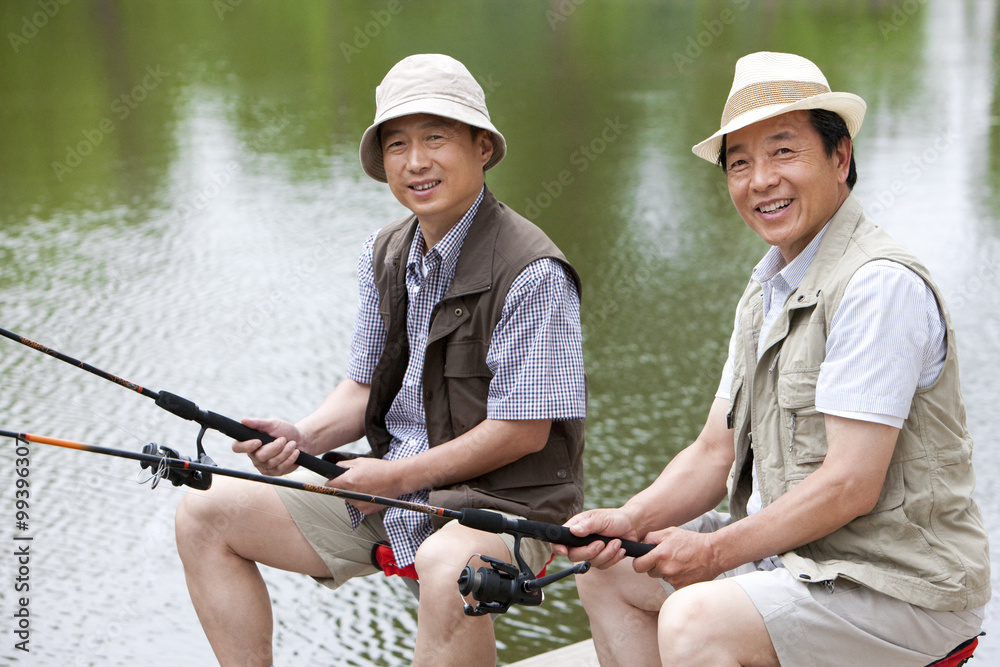 Senior friends fishing together