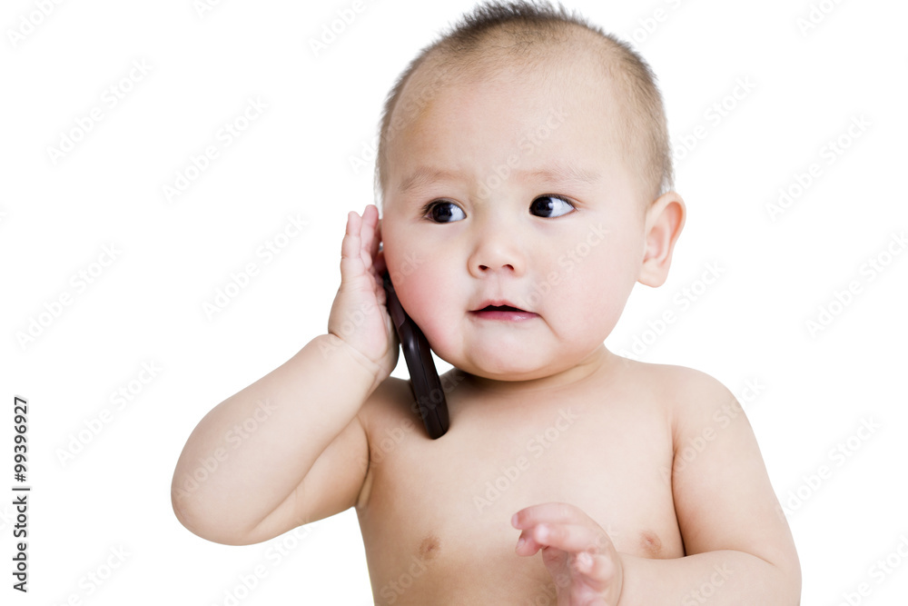 Cute baby boy on the phone