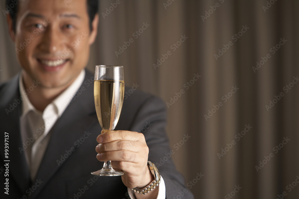 Man holding a glass of champagne