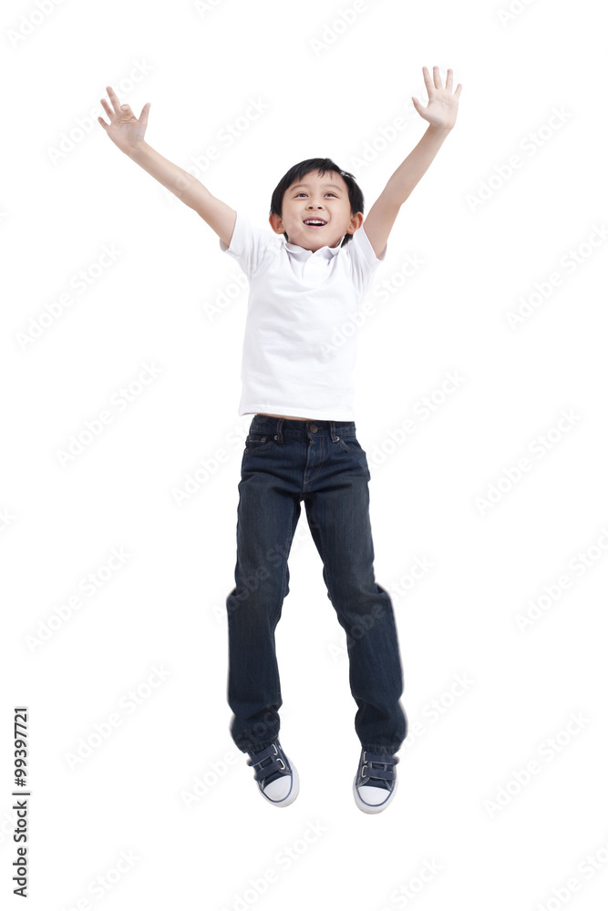 Young boy jumping in mid-air