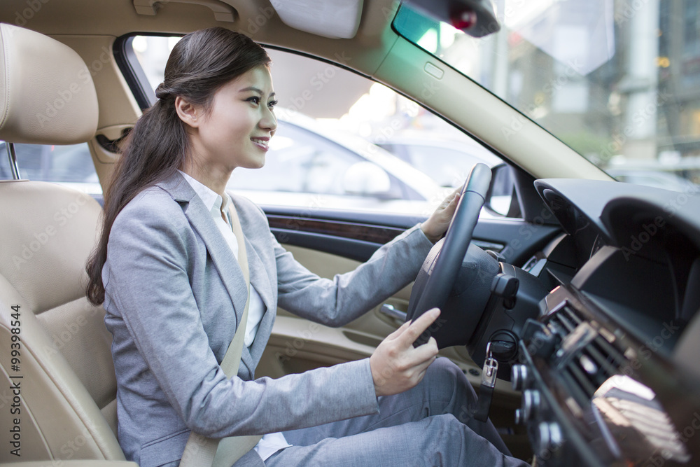 Businesswoman driving car