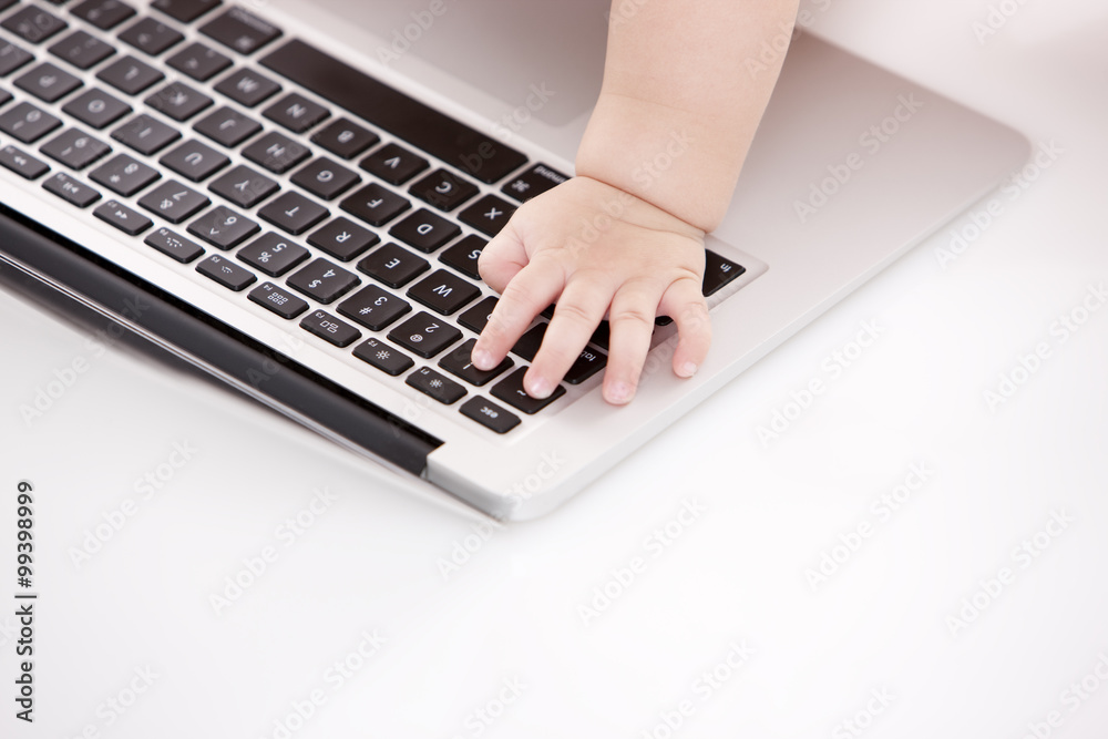 Cute baby girl with laptop