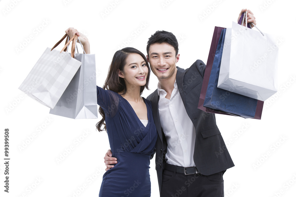 Happy young couple with shopping bags