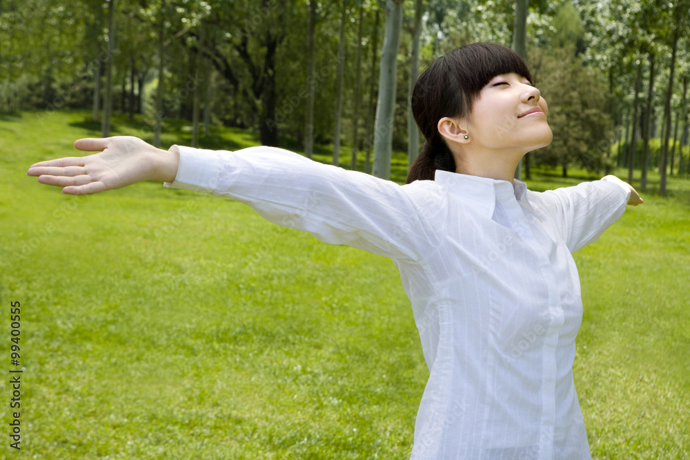 Asian woman on grass