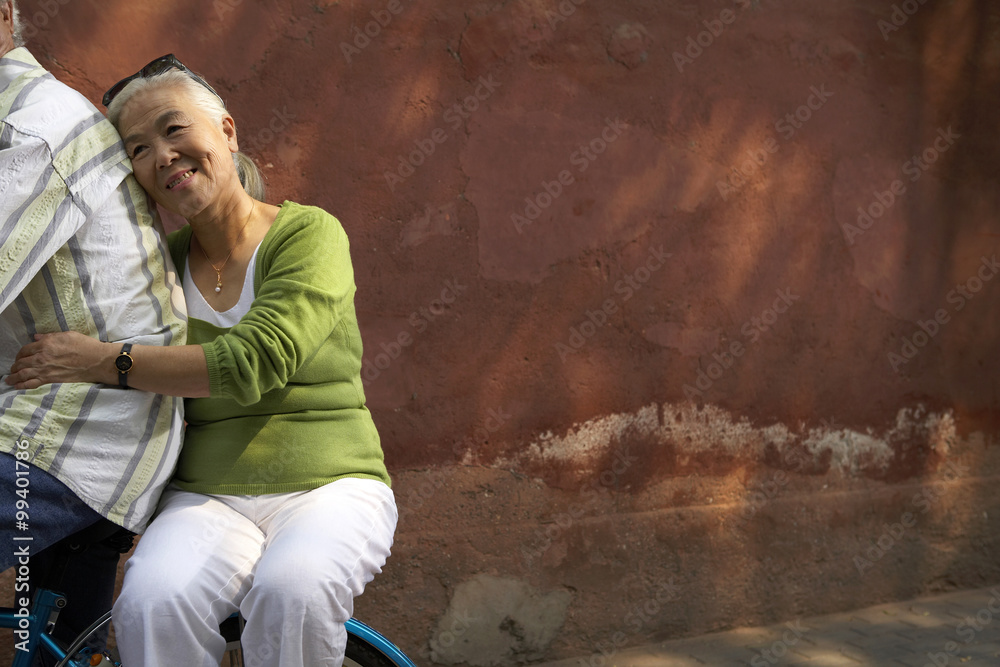 Portrait Of Elderly Woman On A Bicycle