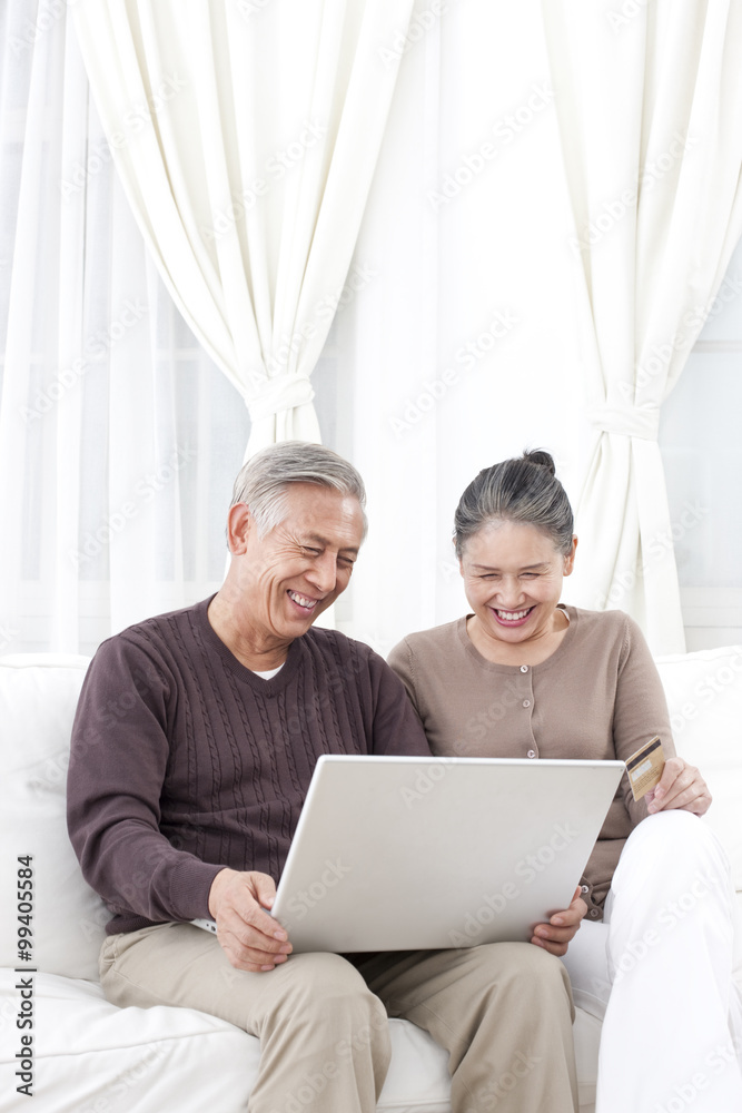 Senior couple online shopping