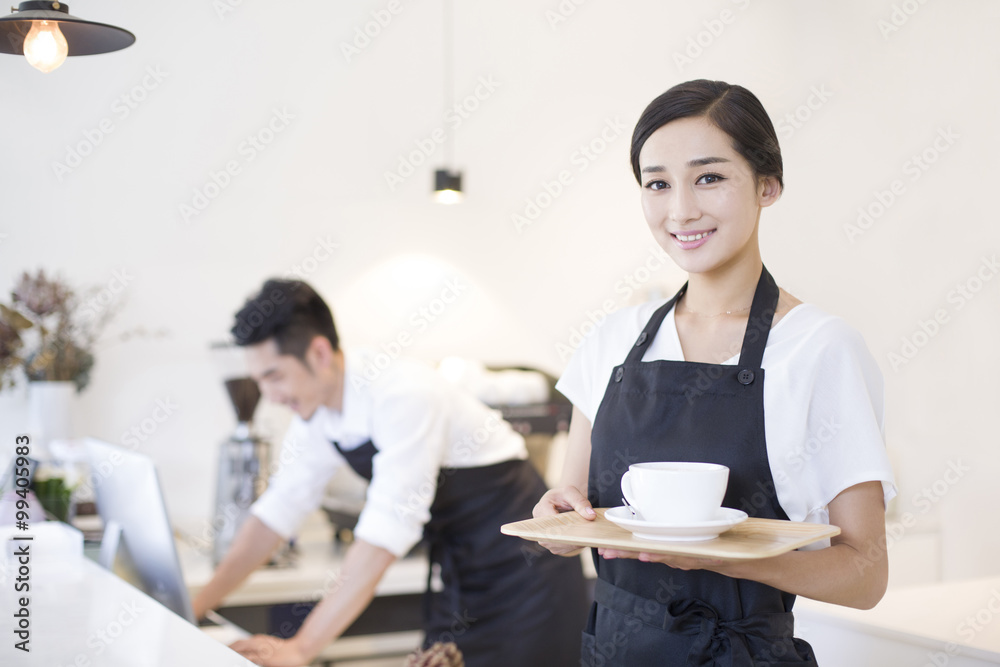 Portrait of coffee shop waitress