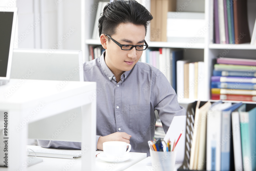 Young businessman working in the office