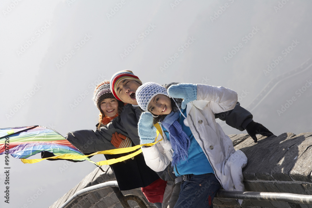 Young People Flying A Kite On The Great Wall Of China