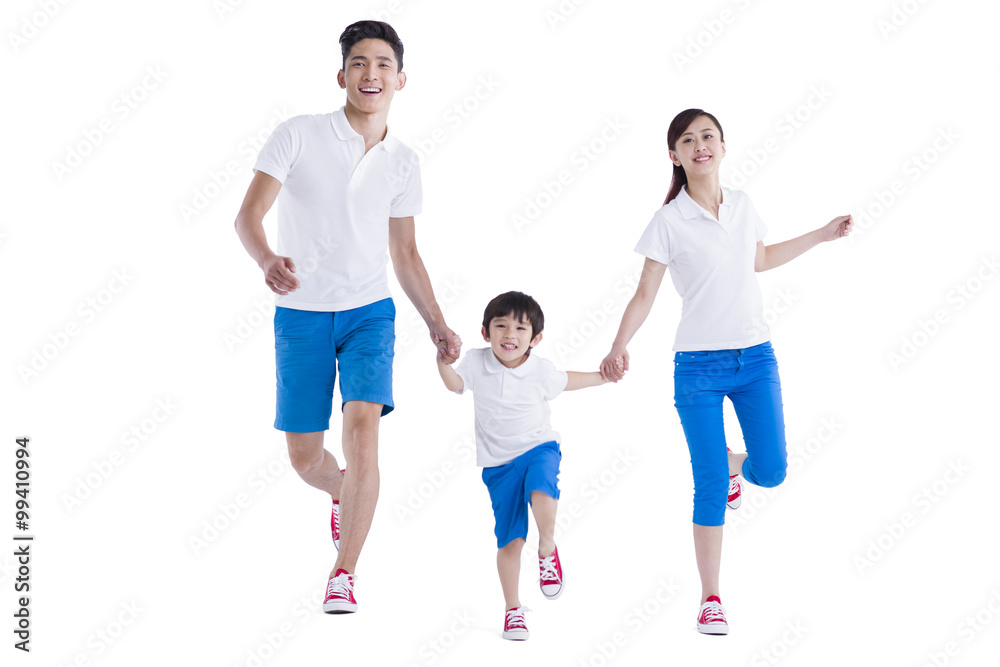 Happy young family holding hands