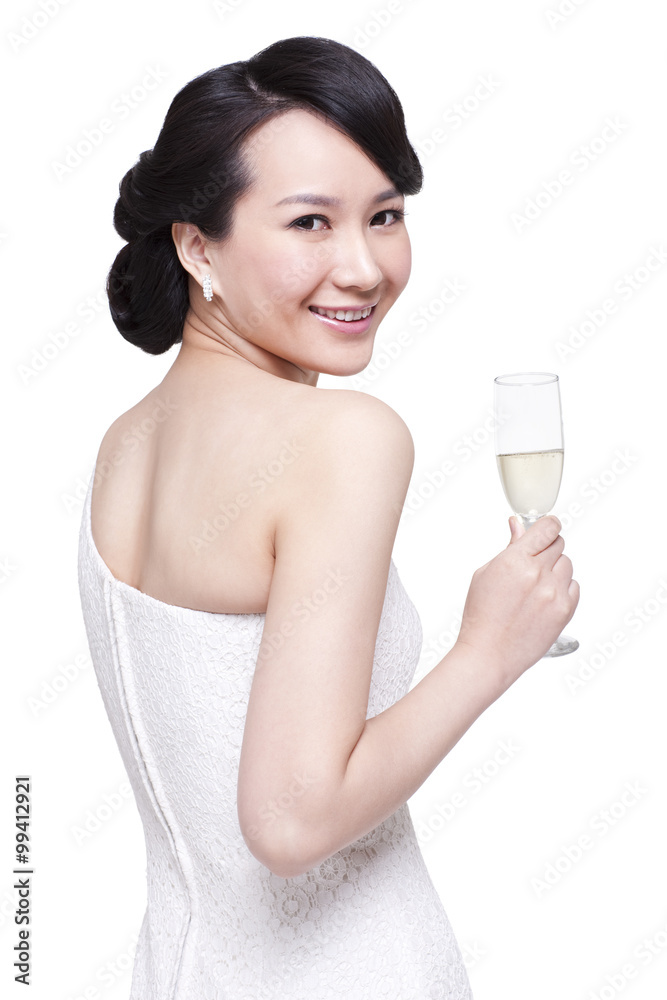 Graceful young woman with champagne flute