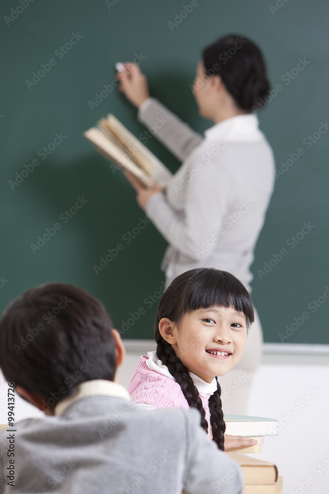 Schoolchildren and teacher in class