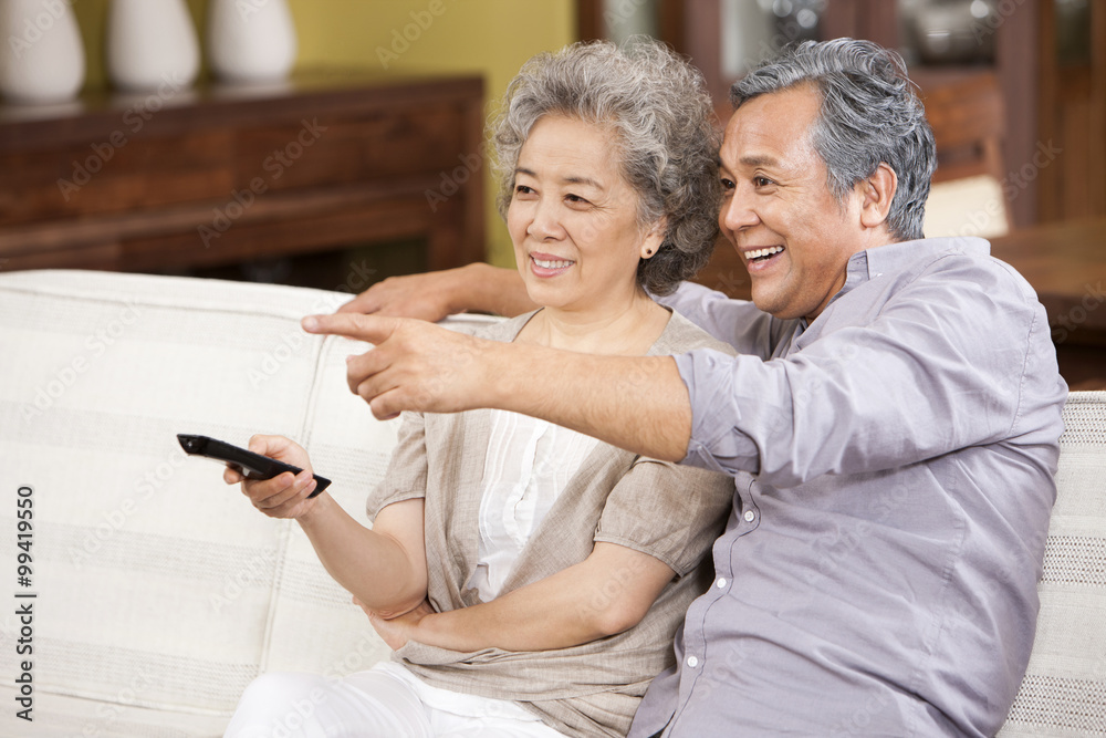 Senior couple watching TV