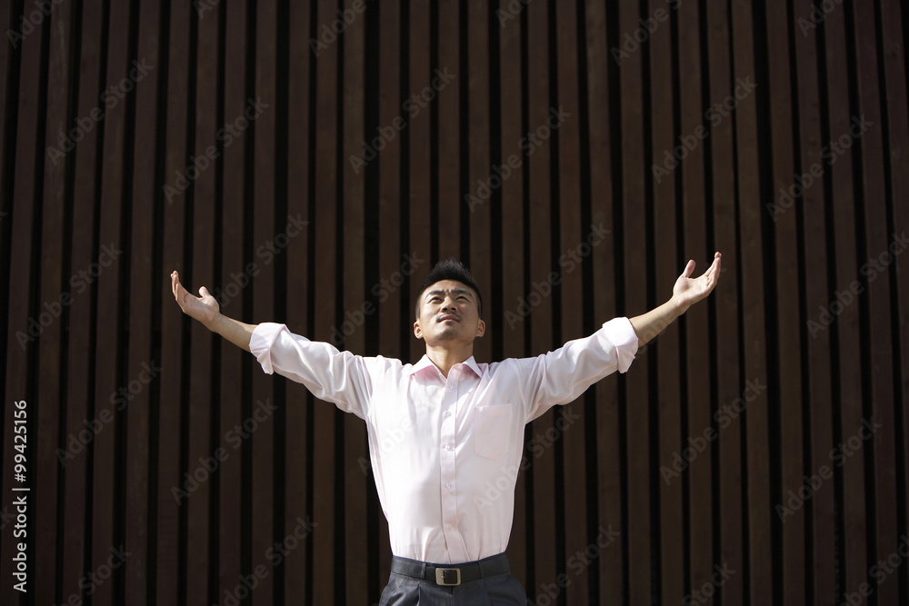 Man Standing Outdoors In Meditation Pose 