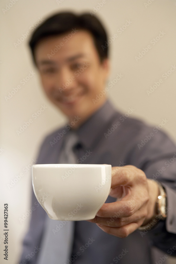 Young Man Holding Coffee Cup