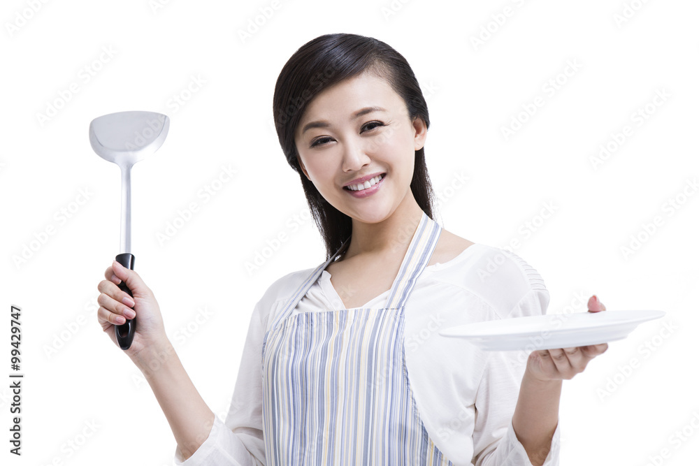 Happy housewife preparing meal