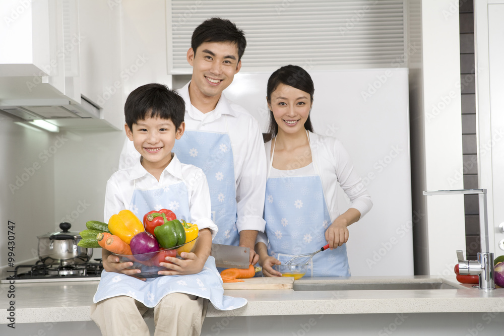 Family cooking in kitchen