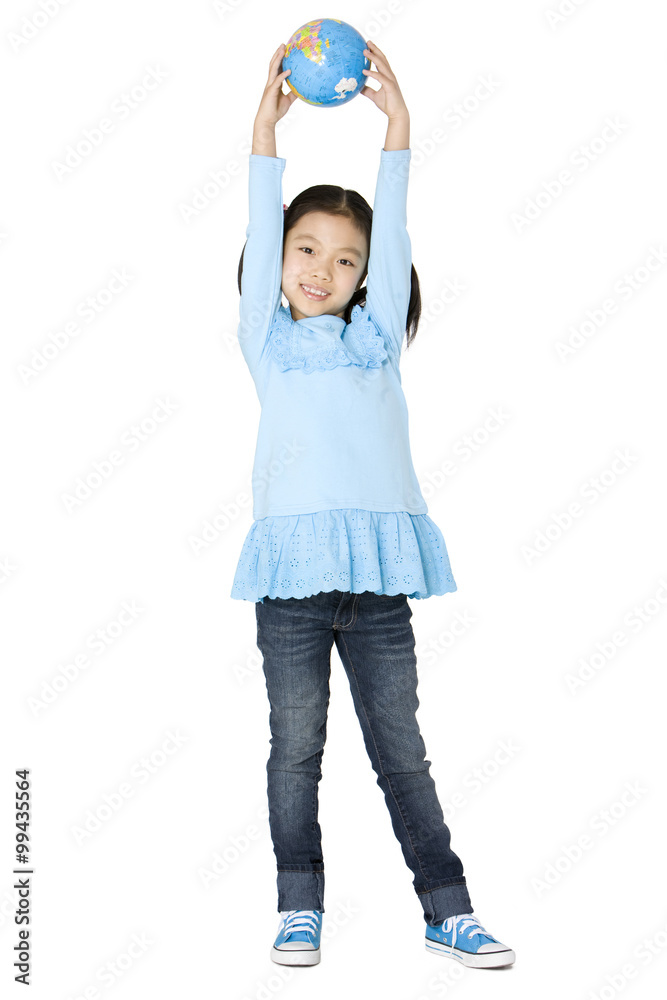 Young girl holding a globe above her head