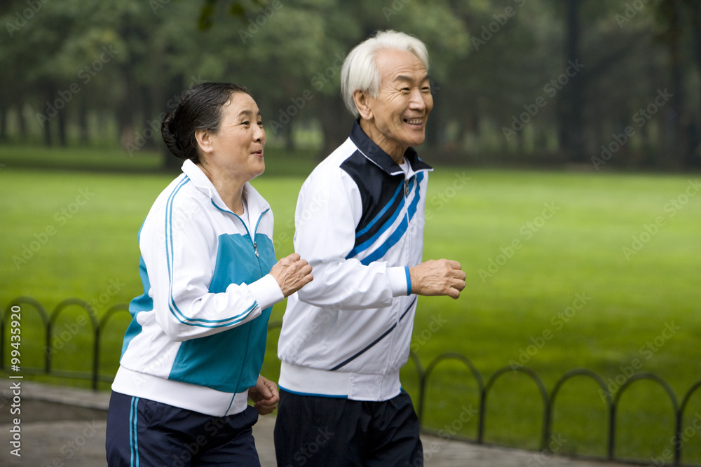 Senior Couple Jogging in a Park