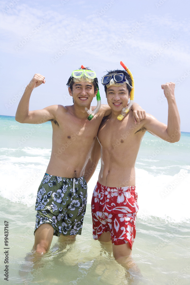 Young men wearing snorkel gear